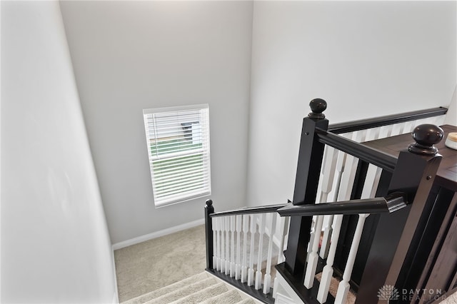 1621 Stonebury Ct, Xenia, OH 45385 - stairway featuring carpet flooring and baseboards