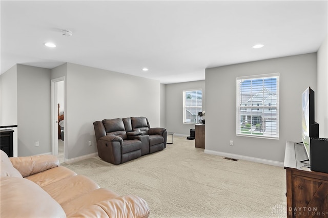 1621 Stonebury Ct, Xenia, OH 45385 - living area with light carpet, baseboards, and recessed lighting