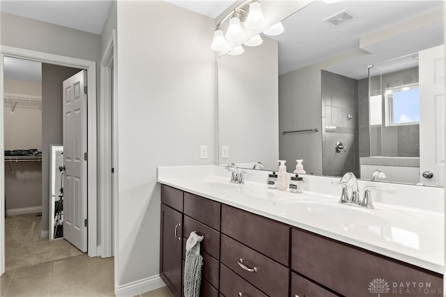 1621 Stonebury Ct, Xenia, OH 45385 - bathroom with walk in shower, baseboards, tile patterned flooring, and double vanity