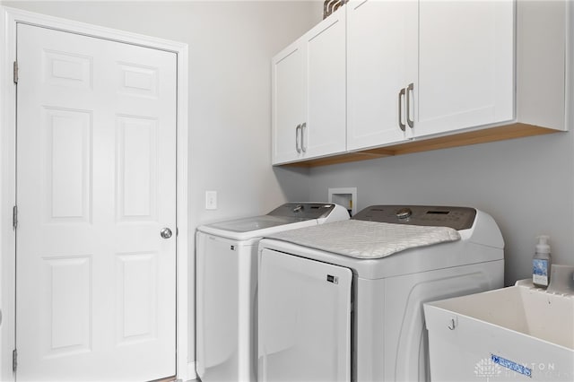 1621 Stonebury Ct, Xenia, OH 45385 - laundry area with cabinet space and separate washer and dryer