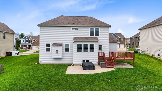 1621 Stonebury Ct, Xenia, OH 45385 - rear view of property with a patio, a deck, a lawn, roof with shingles, and a residential view