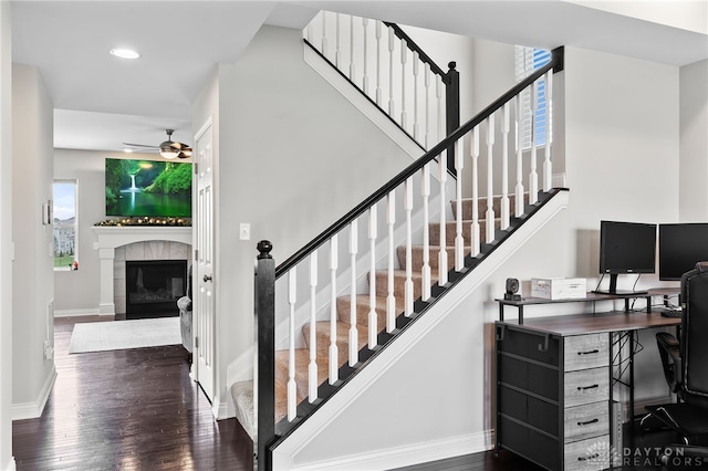 1621 Stonebury Ct, Xenia, OH 45385 - stairway with ceiling fan, wood finished floors, baseboards, a tiled fireplace, and recessed lighting