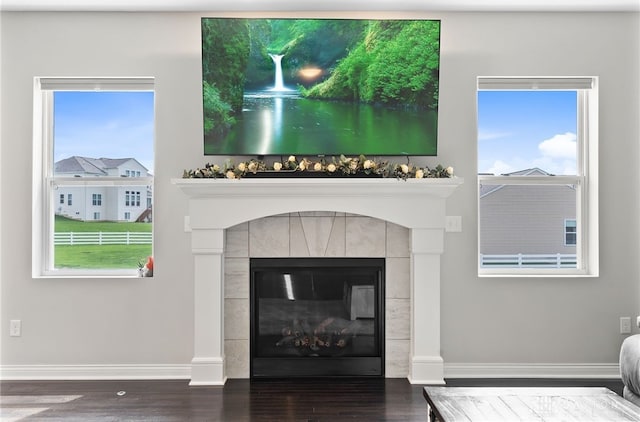 1621 Stonebury Ct, Xenia, OH 45385 - detailed view of baseboards, wood finished floors, and a tile fireplace
