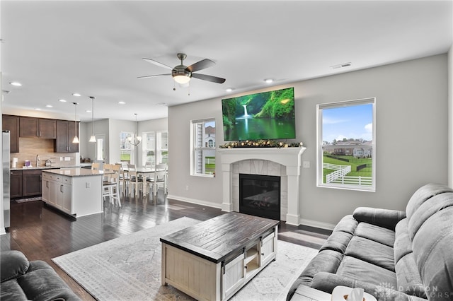 1621 Stonebury Ct, Xenia, OH 45385 - living area with a ceiling fan, recessed lighting, baseboards, a tile fireplace, and dark wood finished floors