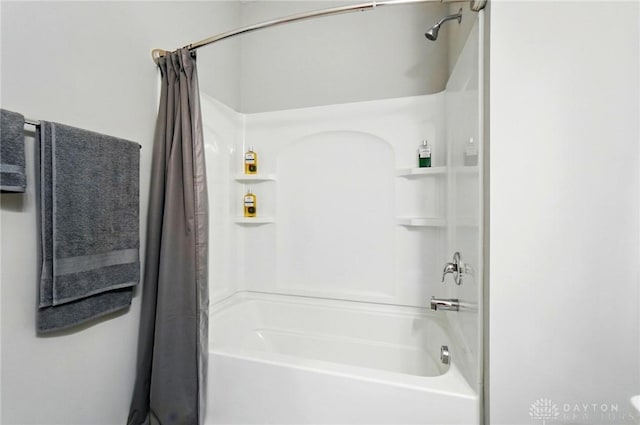 bathroom with shower / bath combo