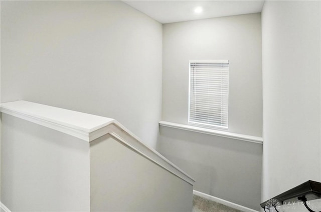 stairs featuring carpet floors, baseboards, and recessed lighting