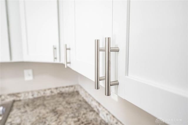 details with light countertops and white cabinets