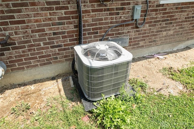details with central AC unit and brick siding