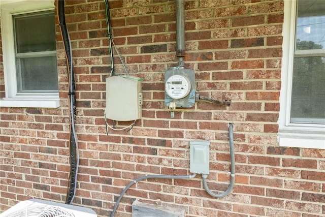 details with brick siding and electric meter
