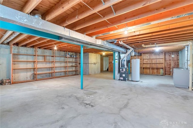 unfinished basement with heating unit and water heater