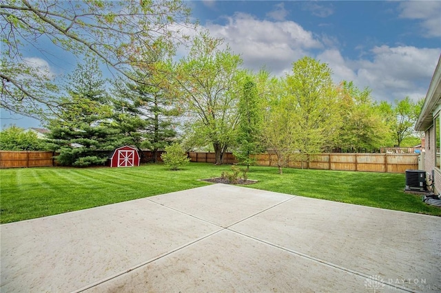 view of patio with central air condition unit, a fenced backyard, a shed, and an outdoor structure