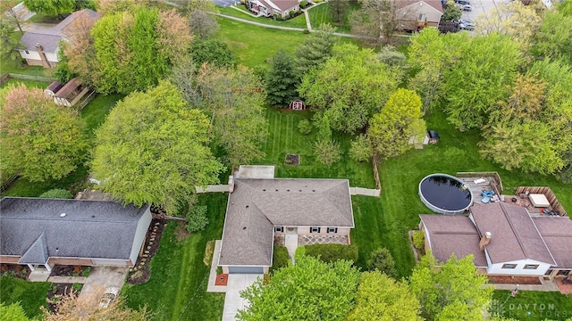 birds eye view of property with a residential view