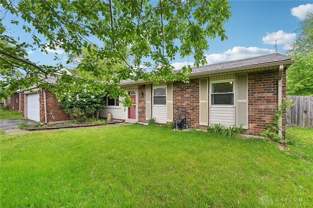 1015 Colorado Dr, Xenia, OH 45385 - ranch-style house with brick siding, a garage, and asphalt driveway