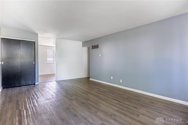 5675 E Coach Dr Unit B, Kettering, OH 45440 - unfurnished bedroom with wood finished floors, a closet, and baseboards