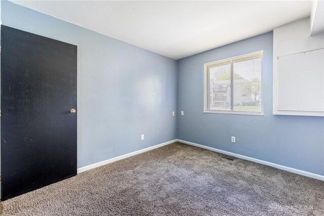 5675 E Coach Dr Unit B, Kettering, OH 45440 - empty room featuring carpet flooring and baseboards