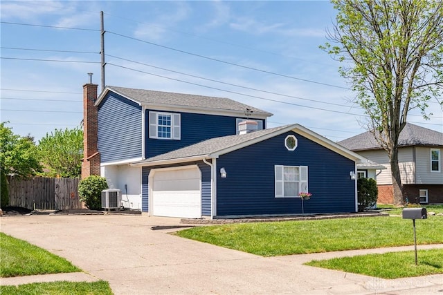 view of front of property with driveway, a front yard, a garage, central air condition unit, and fence