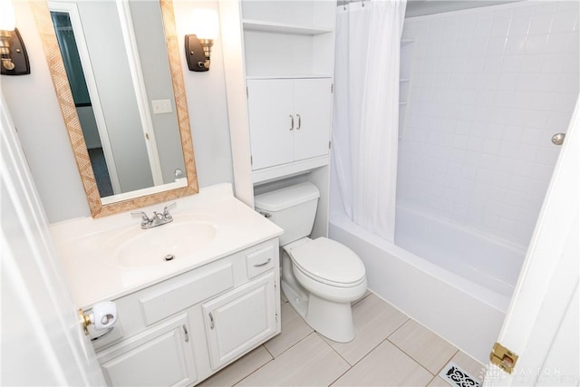 bathroom with vanity, tile patterned floors, shower / bath combo with shower curtain, and toilet