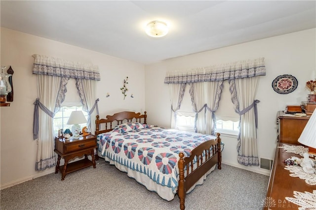 bedroom featuring baseboards and light carpet