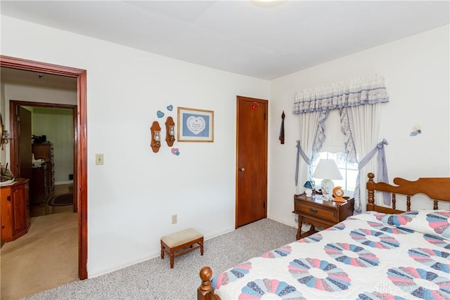 bedroom featuring light carpet