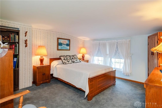 carpeted bedroom featuring baseboards and wallpapered walls