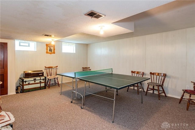 playroom with visible vents, a textured ceiling, and carpet floors