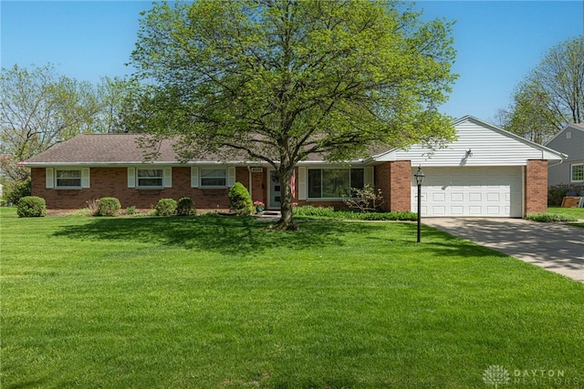 4600 Wing View Ln, Kettering, OH 45429 - ranch-style home with brick siding, an attached garage, driveway, and a front yard