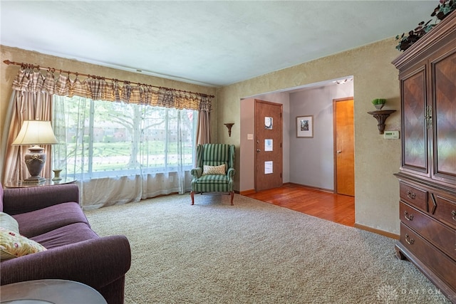 4600 Wing View Ln, Kettering, OH 45429 - living room featuring carpet floors, baseboards, and a textured wall
