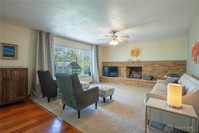 4600 Wing View Ln, Kettering, OH 45429 - living area featuring ceiling fan, a fireplace, and wood finished floors