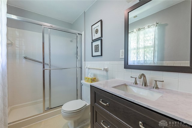 4600 Wing View Ln, Kettering, OH 45429 - bathroom featuring a stall shower, toilet, vanity, and tile walls