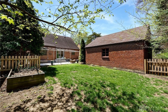 view of yard featuring fence and a patio area