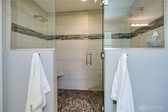 full bath with a tile shower