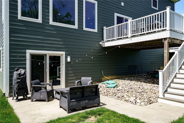 view of patio with an outdoor hangout area, a deck, and stairway