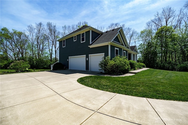 view of property exterior featuring a lawn, an attached garage, driveway, and a shingled roof