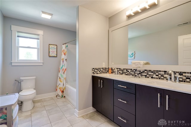 full bathroom featuring backsplash, toilet, visible vents, and a sink