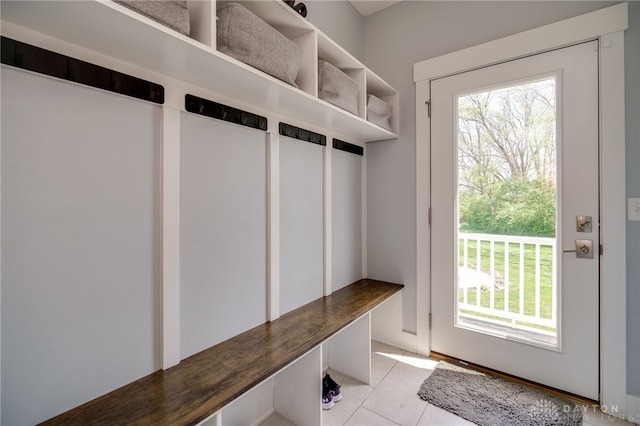 mudroom with light tile patterned floors and a healthy amount of sunlight