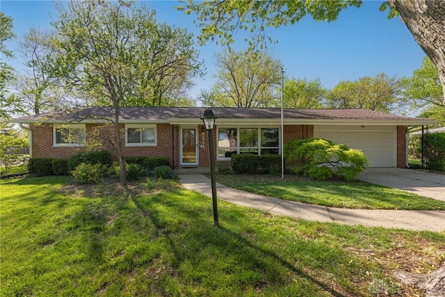 ranch-style home featuring brick siding, a garage, a front lawn, and concrete driveway