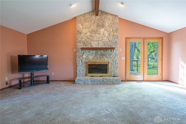 unfurnished living room featuring vaulted ceiling with beams, carpet flooring, baseboards, and a stone fireplace