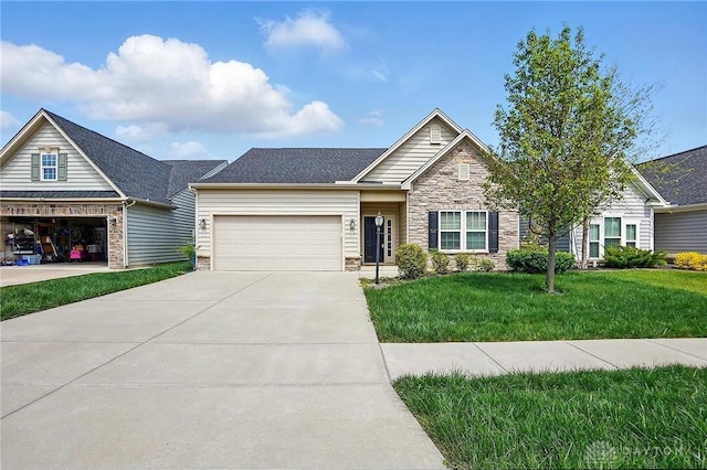 view of front of home featuring an attached garage, a front yard, stone siding, and concrete driveway