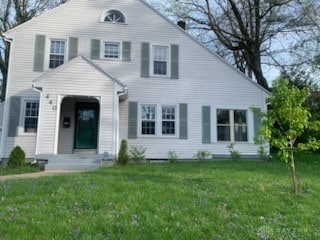 view of front of home with a front lawn