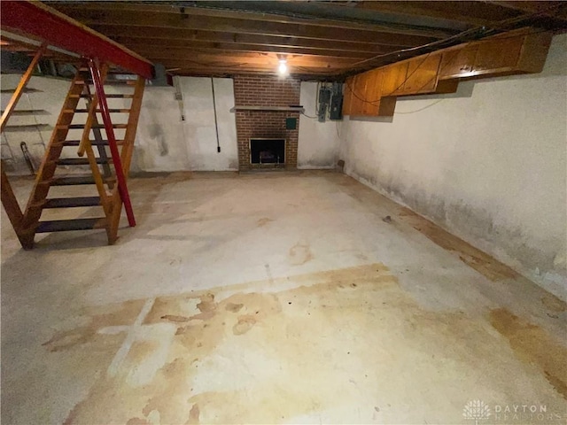 unfinished below grade area with stairway and a fireplace