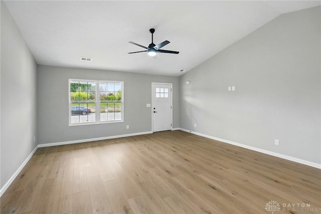 2067 Pine Forest Dr, Miamisburg, OH 45342 - unfurnished living room featuring vaulted ceiling, wood finished floors, a ceiling fan, and baseboards
