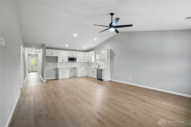 2067 Pine Forest Dr, Miamisburg, OH 45342 - unfurnished living room with lofted ceiling, a sink, ceiling fan, baseboards, and recessed lighting