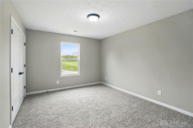 2067 Pine Forest Dr, Miamisburg, OH 45342 - unfurnished bedroom with carpet flooring, baseboards, and a textured ceiling