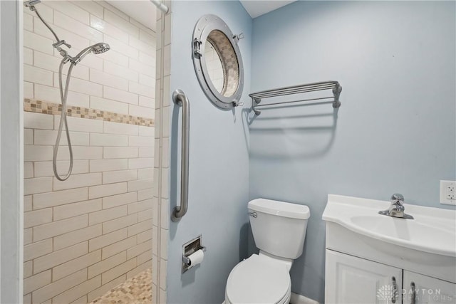 871 Van Eaton Rd, Spring Valley Twp, OH 45385 - bathroom featuring vanity, a tile shower, and toilet