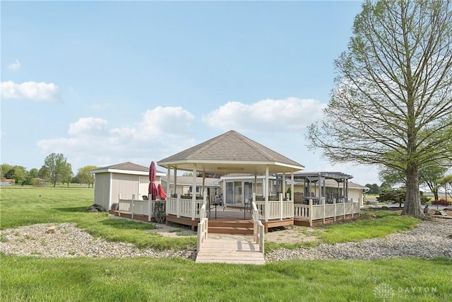 871 Van Eaton Rd, Spring Valley Twp, OH 45385 - back of house featuring a lawn, a pergola, and a wooden deck