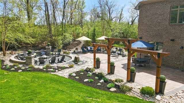 exterior space featuring an outdoor fire pit, a patio area, and outdoor dining space