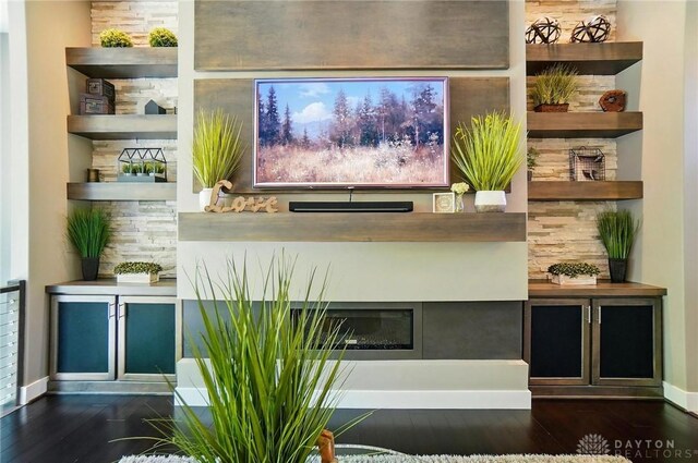 bar featuring baseboards and wood finished floors