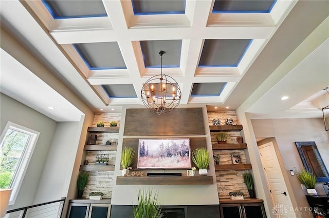 living room featuring coffered ceiling, recessed lighting, beam ceiling, and a notable chandelier