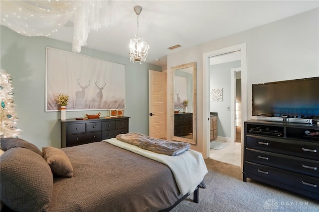 bedroom featuring carpet floors, a notable chandelier, and visible vents