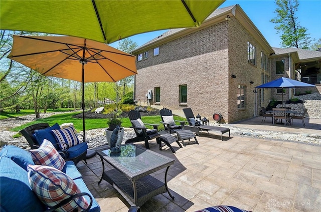 view of patio with outdoor dining area and an outdoor living space